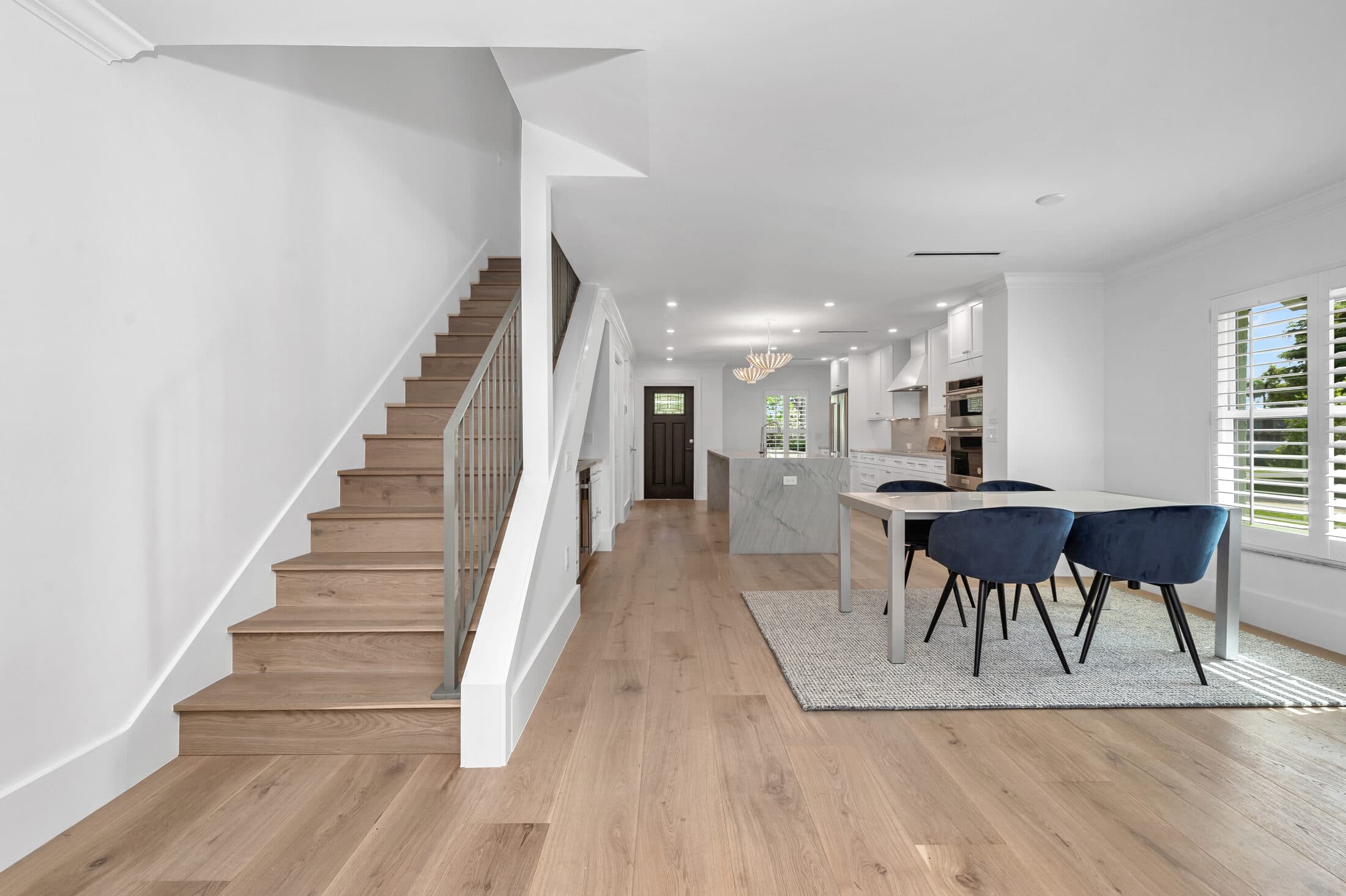 Dining area and stairway in RIVA MAX Crystal hardwood