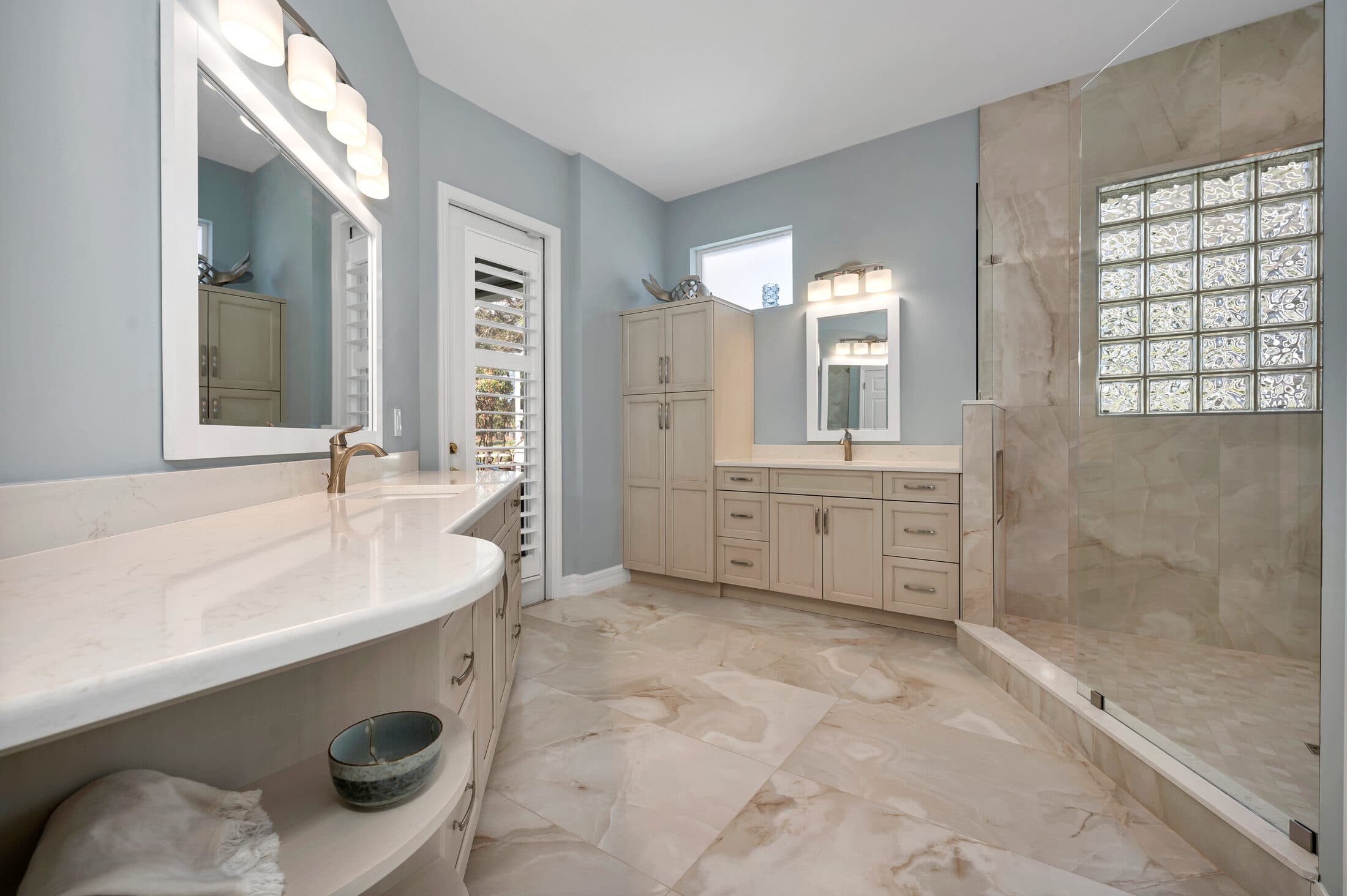 Grand Cypress primary bath with tiled floor and walls