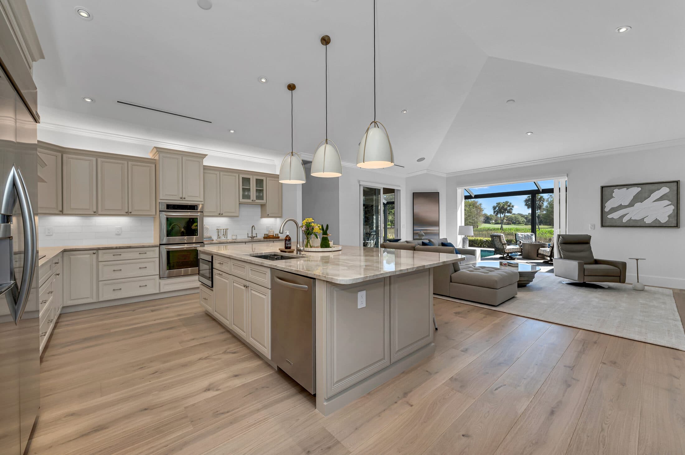 Kitchen with light oak floors and island