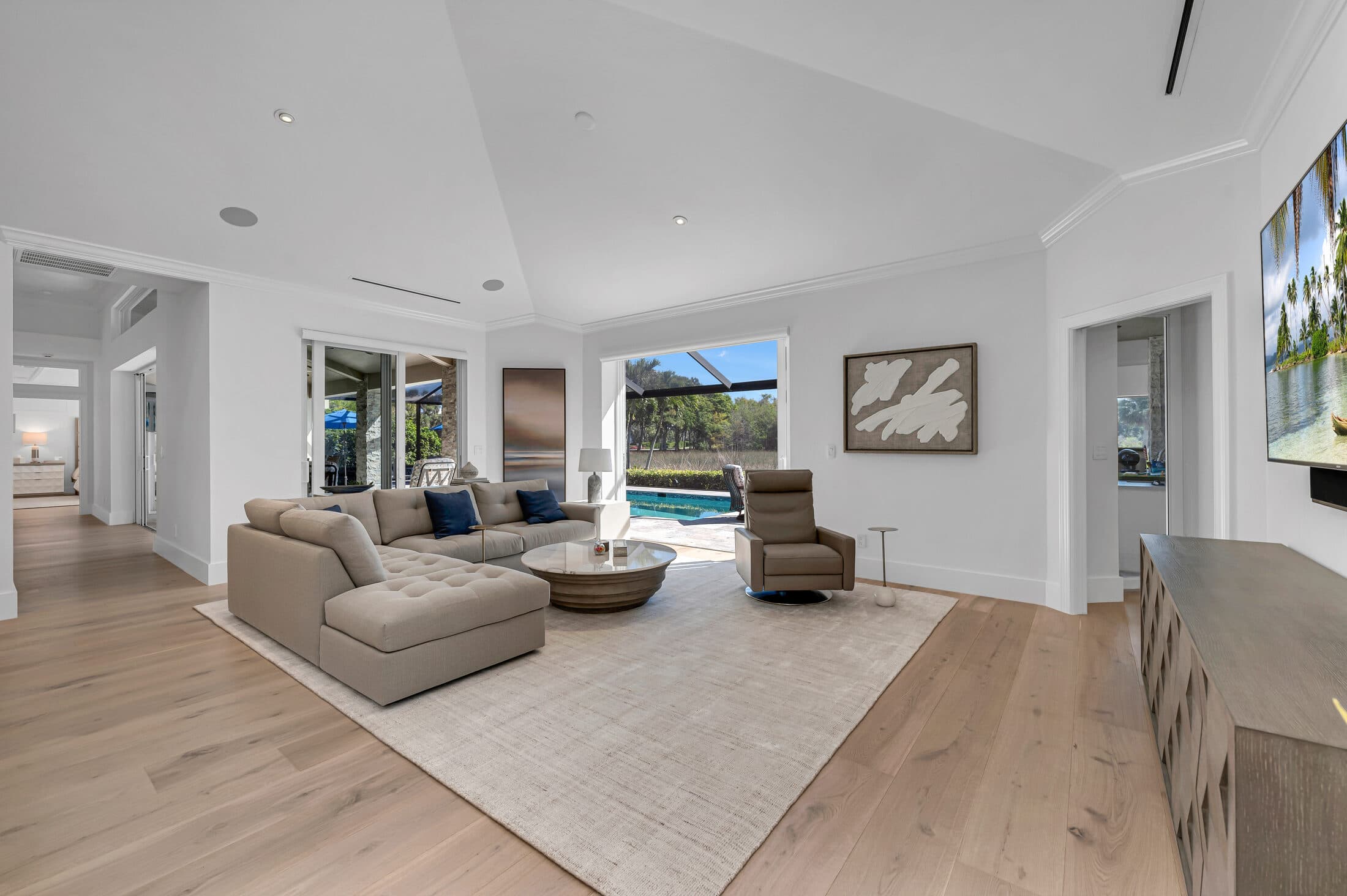 Pembroke Point great room in Crystal-colored RIVA wide-plank oak on a Naples slab