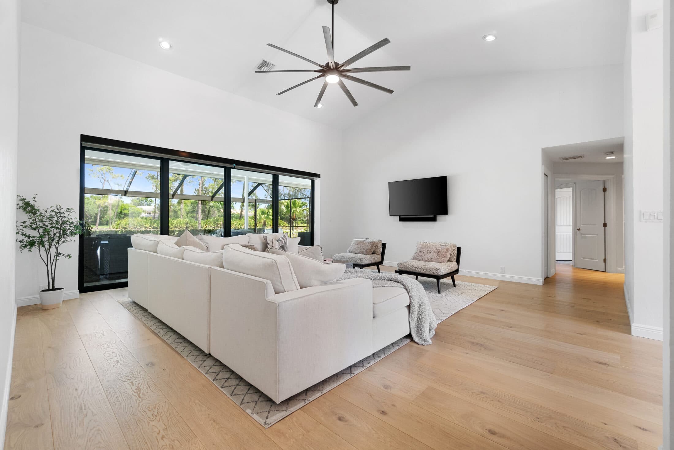 Finished home in Quail Creek, Naples. Wide-plank hardwood under beamed ceilings.