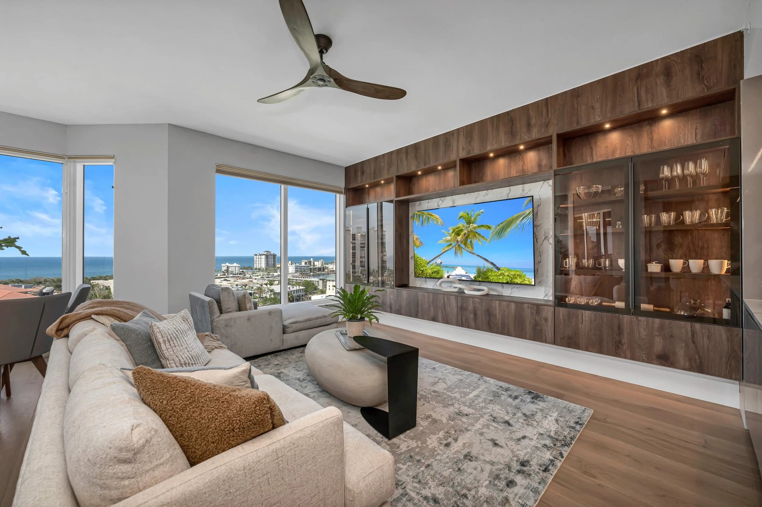 Bay Colony tower interior with wide-plank oak and a Gulf view