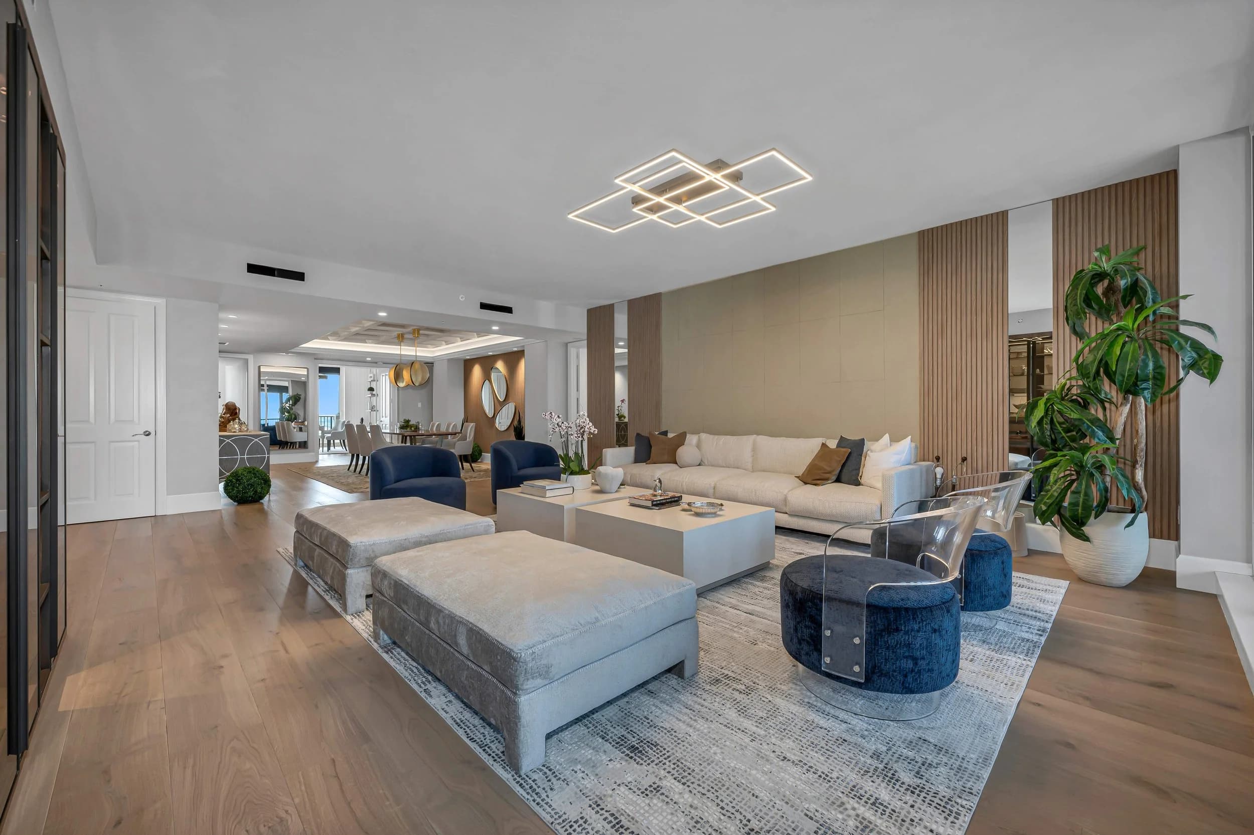 Bright Bay Colony great room with a large soft area rug over the living area