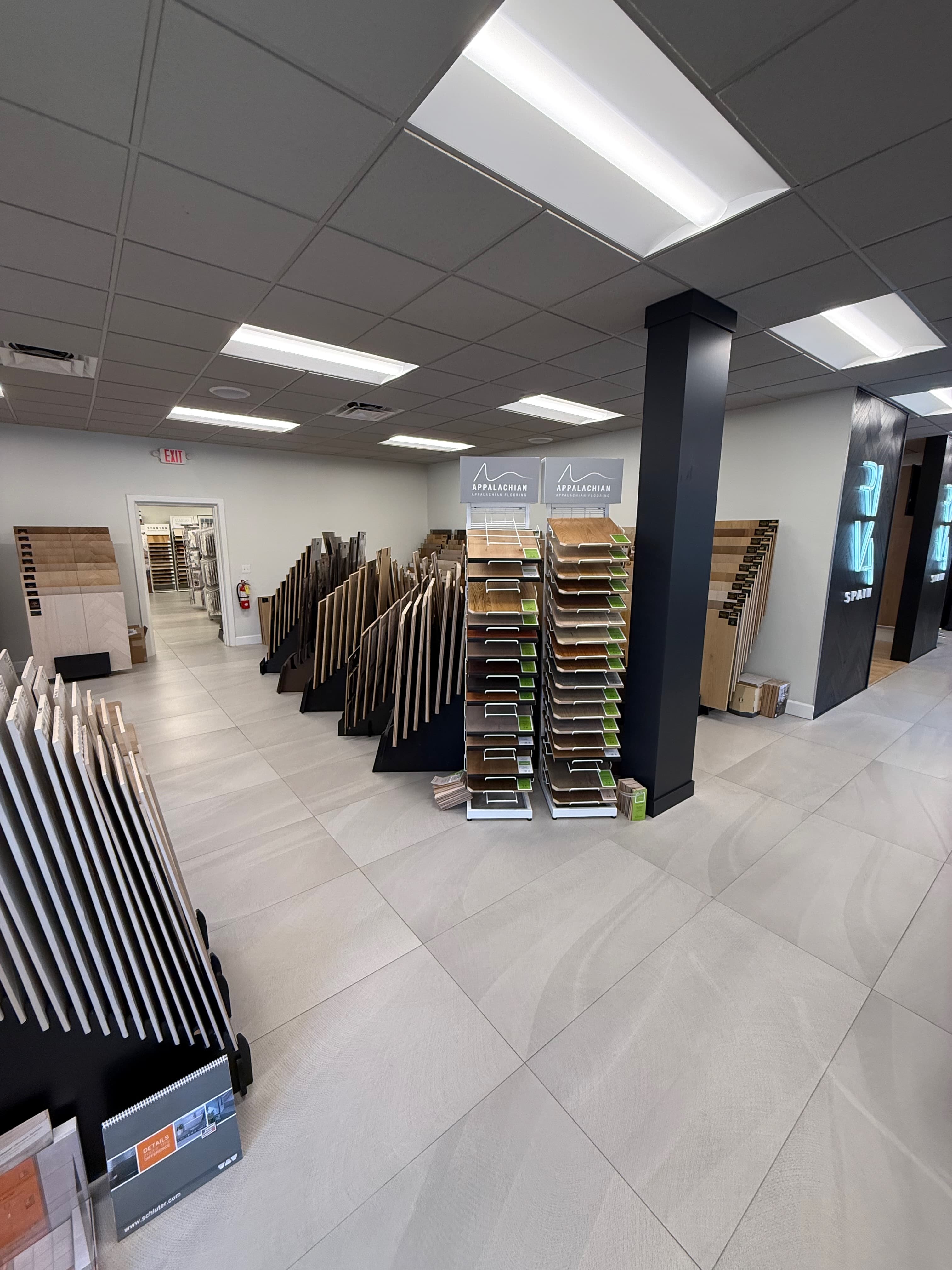 ProFloors Naples hardwood gallery wall with wide-plank flooring samples on display