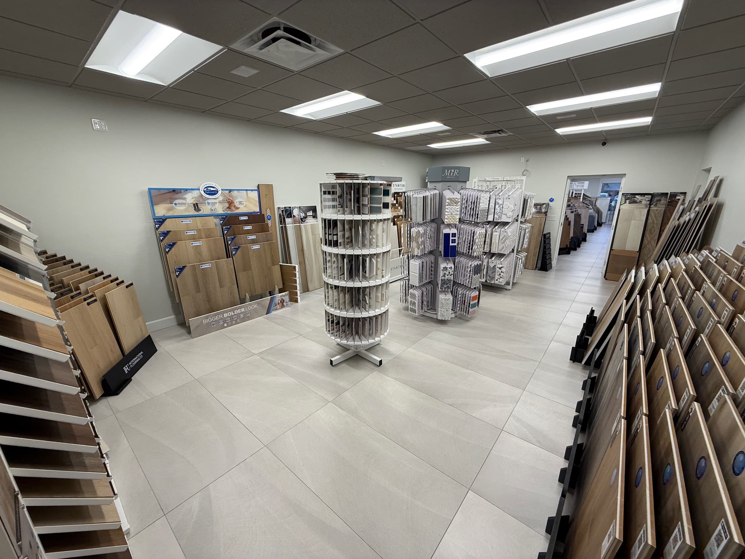 Flooring and tile sample displays on the showroom floor at ProFloors in Naples.