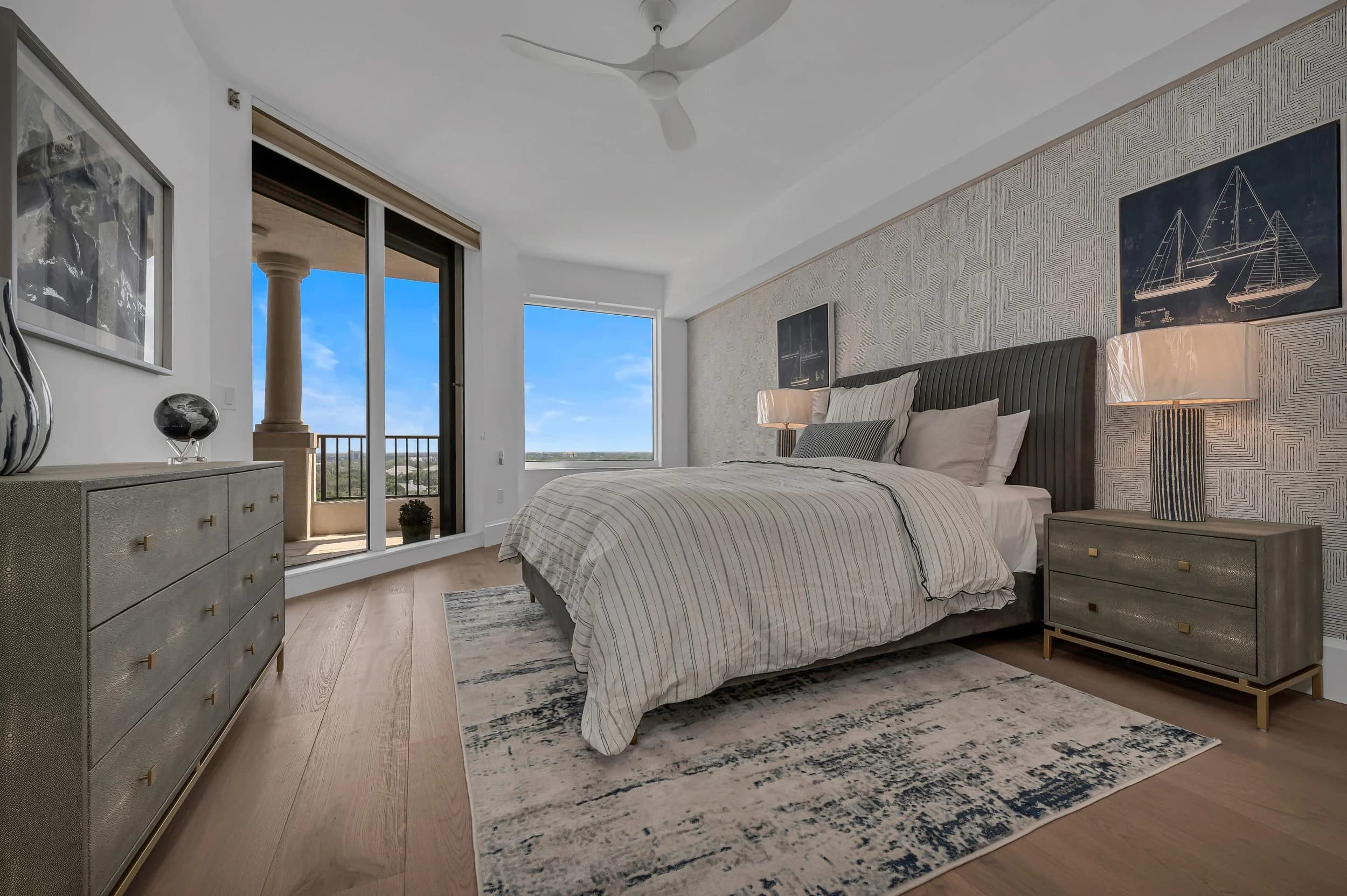 Sunlit Bay Colony primary bedroom with a soft rug warm underfoot and the Gulf beyond the balcony