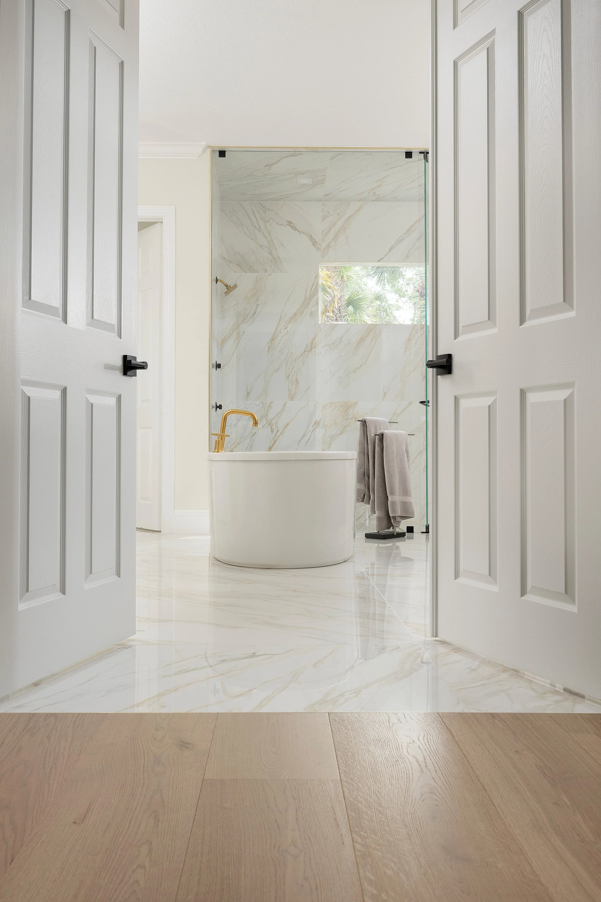 Primary bath. Real marble surround, the one room you want to read as genuine.