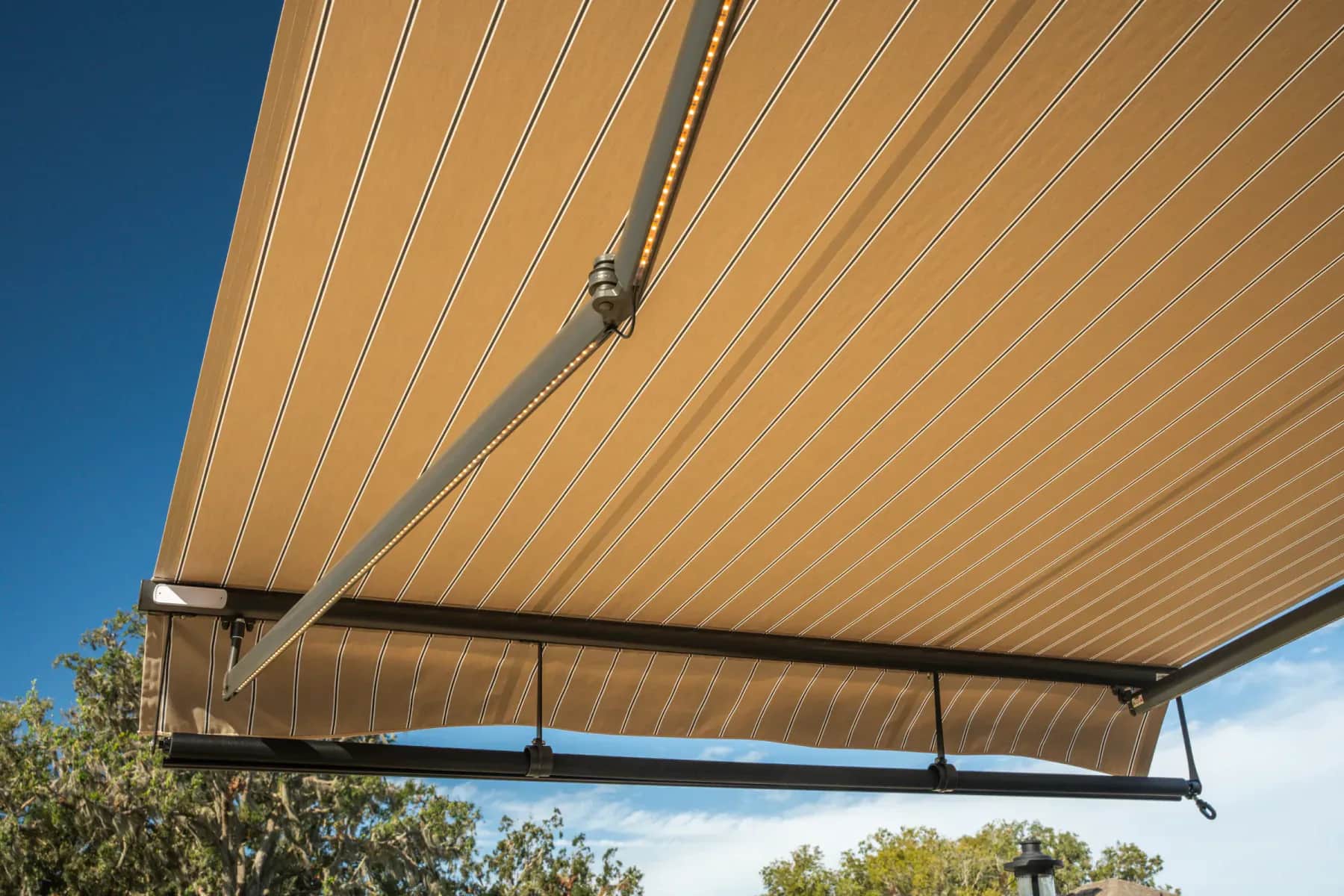 Wireless wind sensor mounted beneath a SunPro retractable awning